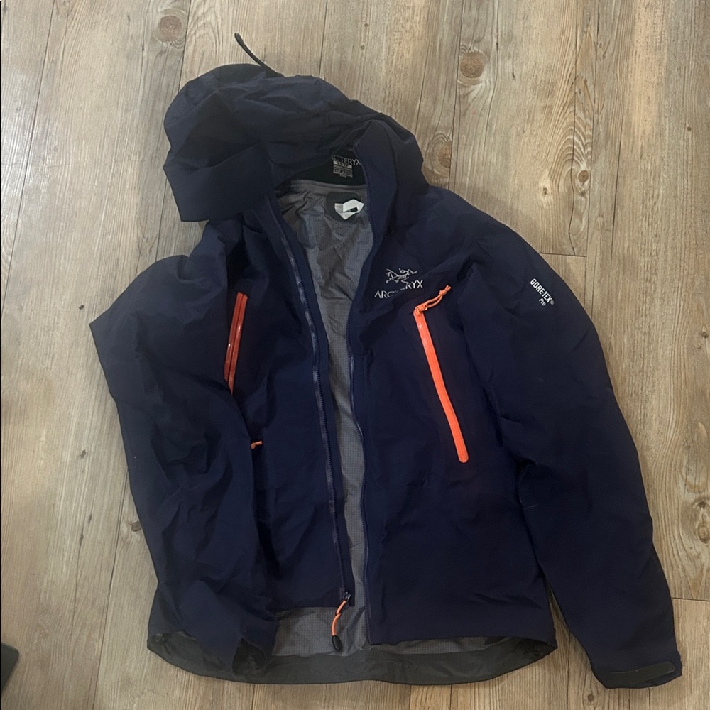 Arc'teryx Women’s Beta LT Jacket Sapphire color with Bright Orange Zippers